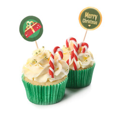 Tasty Christmas cupcakes on white background