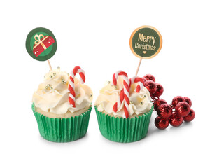 Tasty Christmas cupcakes on white background