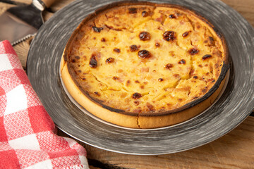 delicious round quiche with ham and homemade bacon