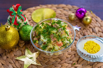 general top view, traditional russian new year and christmas olivier salad decorated with parsley, new year and christmas celebration in thailand, vegetarian and vegan egg