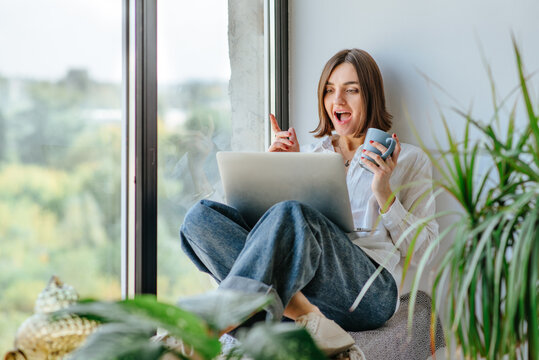 Young woman using laptop for work or education from home