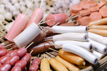 Steamed meatballs are placed on a wooden tray in the pedestrian street.