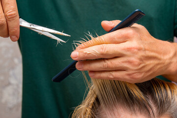 womens blonde hair cut with scissors