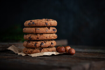 Chocolate cookies on wooden table.