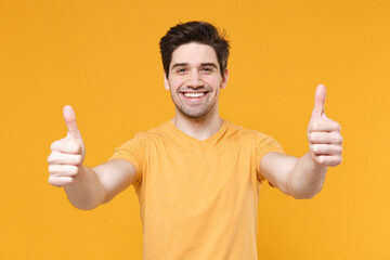 Young excited satisfied unshaved caucasian smiling man 20s years old wearing casual basic blank...