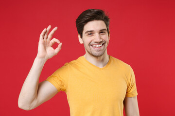 Young satisfied gladden satisfied happy smiling unshaved caucasian handsome man 20s in casual basic...