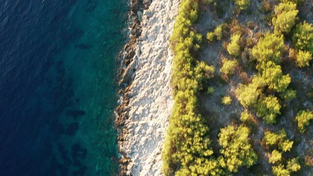 Aerial view of the green shores of the island Korcula at sunset, Croatia.