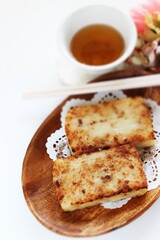Chinese New Year food, turnip cake on dish also for dim sum yam cha cuisine