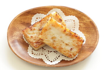 Chinese New Year food, turnip cake on dish also for dim sum yam cha cuisine