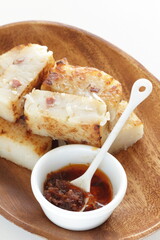 Chinese New Year food, turnip cake on dish also for dim sum yam cha cuisine