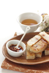 Chinese New Year food, turnip cake on dish also for dim sum yam cha cuisine