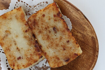 Chinese New Year food, turnip cake on dish also for dim sum yam cha cuisine
