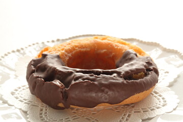 Chocolate old fashion donut on dish with copy space