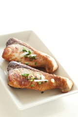 Asiian food, fried yellowtail fillet on dish with copy space