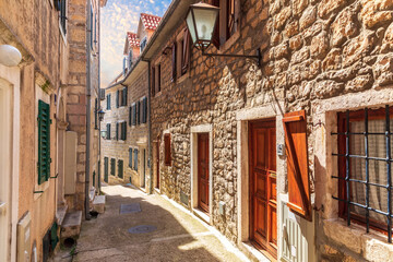 Fototapeta na wymiar Narrow european street in the old town of Herceg Novi, Montenegro