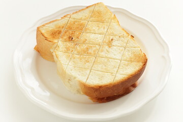 Toasted bread with cut pattern on dish
