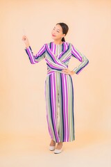 Portrait beautiful young asian woman smile relax in action on color
