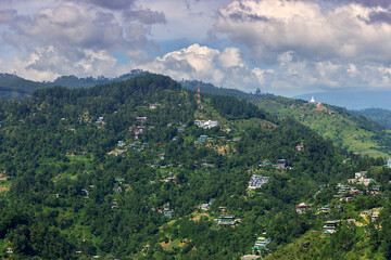 Village on the slope of a forest mountain