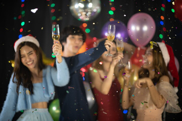 Happy Asian friends celebrating new year's eve 2021- people having fun together in patio home party - Winter and holidays concept
