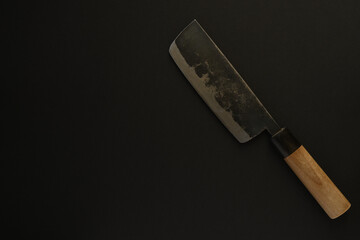 Japanese kitchen knife on black background.