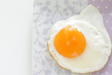 Sunny side up fried egg on dish for breakfast