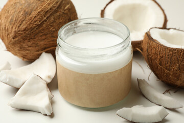 Fresh coconut and coconut milk on white background