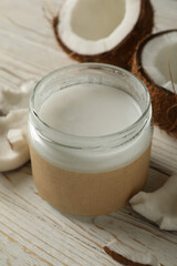 Fresh coconut and coconut milk on wooden background
