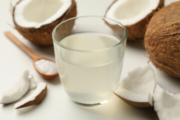 Fresh coconut and coconut milk on white background