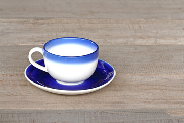 cup of coffee on wooden table