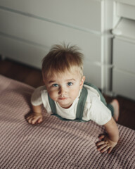 Fototapeta premium Baby boy at home. Top view