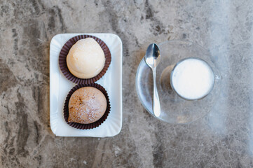 Top view Close-up Italian macchiato coffe with pastries on the table. Traditional food, break concept.