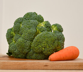 Broccoli with carrot on the cutting plate