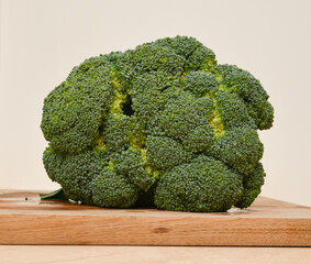 Fresh broccoli on cutting plate