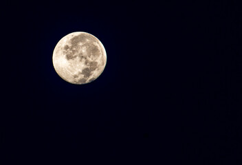 The full moon in the sky at night is black.