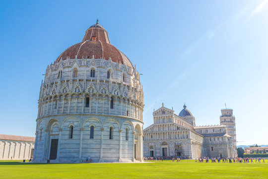 A beautiful day with clear clouds shot of  San Giovanni Baptistery, the Cathedral of pisa and the leaning tower of pisa in piazza del duomo Pisa, Italy