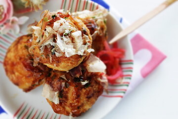 Japanese summer street food, Takoyaki octopus ball on dish 