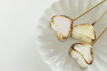 Barbecue heart shaped Marshmallow on dish for dessert
