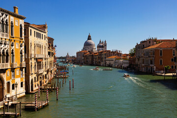 Fototapeta na wymiar Panorama of Grand canal with boats and gondolas on sunny summer day in Venice. Italy