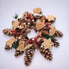 Christmas decorations with pine cones, nuts and handmade Christmas cookies