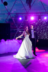 the bride and groom dance the first wedding dance at the Banquet. 