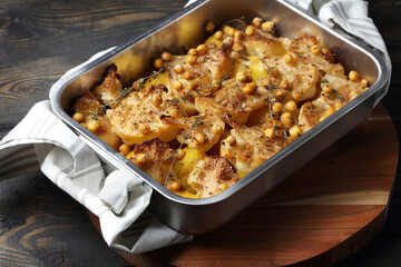 Oven baked potatoes, cauliflower, chickpeas with thyme and freshly ground black pepper