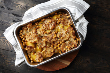 Oven baked potatoes, cauliflower, chickpeas with thyme and freshly ground black pepper
