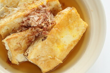 Japanese food, pan fried tofu and soy sauce with Katsuobushi