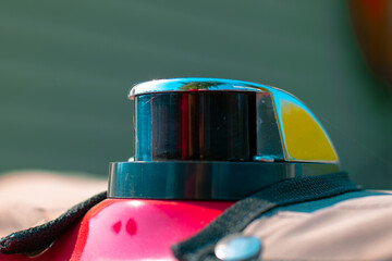 Navigation light on the bow of a red boat