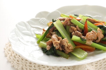 Chinese food, pork and green leaves vegetable stir fried