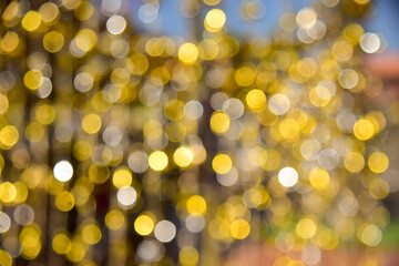 Gold glitter vintage lights background. defocused