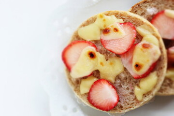 homemade sugar and cheese with strawberry in English muffin sandwich