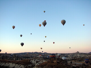 The unsurpassed beauty of an infinite number of balloons rising above the valley into the morning sky illuminated by the colors of the sunrise.