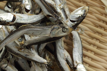 Japanese food ingredient,  dried small sardines on bamboo basket for broth cooking