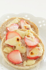 homemade sugar and cheese with strawberry in English muffin sandwich